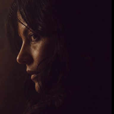 Romy Venn in a shadowed side profile.
